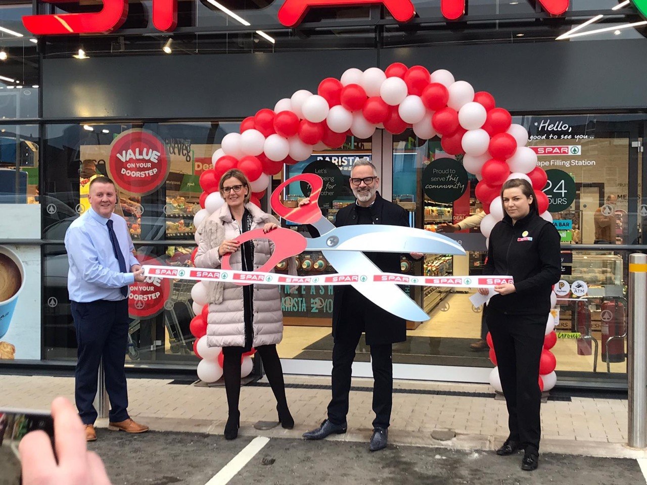 Ribbon cutting ceremony at a Wall Group store opening